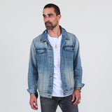 Man wearing a denim jacket, white t-shirt, gray jeans on a white background