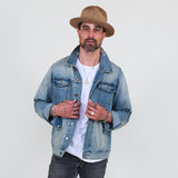 Man wearing a denim jacket, white t-shirt, gray jeans on a white background