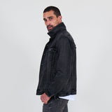 Man wearing a black jacket, gray jeans on a white background