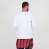 Man wearing a white sweater and blue jeans on a white background