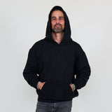 Person wearing a black hoodie and against a white background
