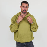 Person wearing a green hoodie and against a white background