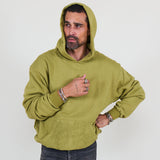 Person wearing a green hoodie and against a white background