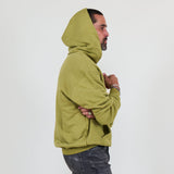 Person wearing a green hoodie and against a white background