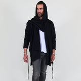 Man wearing a black shawl, white shirt, gray pants on a white background