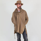 Man wearing a beige shawl, white shirt, gray pants on a white background