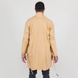 Man wearing a beige shawl, white shirt, gray pants on a white background