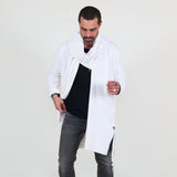 Man wearing a white shawl, black shirt, gray pants on a white background