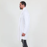 Man wearing a white shawl, white shirt, gray pants on a white background