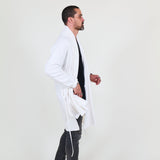 Man wearing a white shawl, black shirt, gray pants on a white background