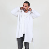 Man wearing a white shawl, white shirt, gray pants on a white background